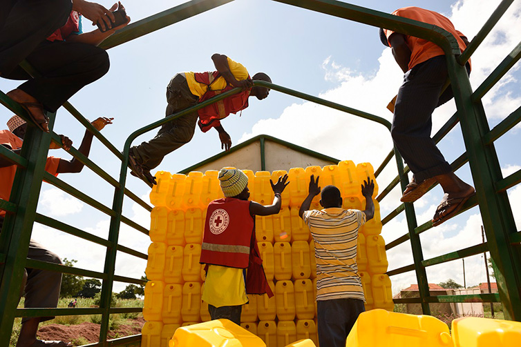 Red Cross distributes jerry cans in Uganda in November 2015 in advance of predicted floods