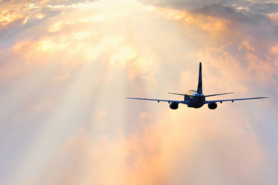 Passenger plane flying through clouds